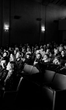 a black and white photo of a crowd of people